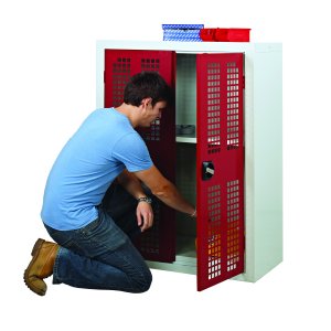 Perforated door cupboard with two shelves for ventilated and organized storage.